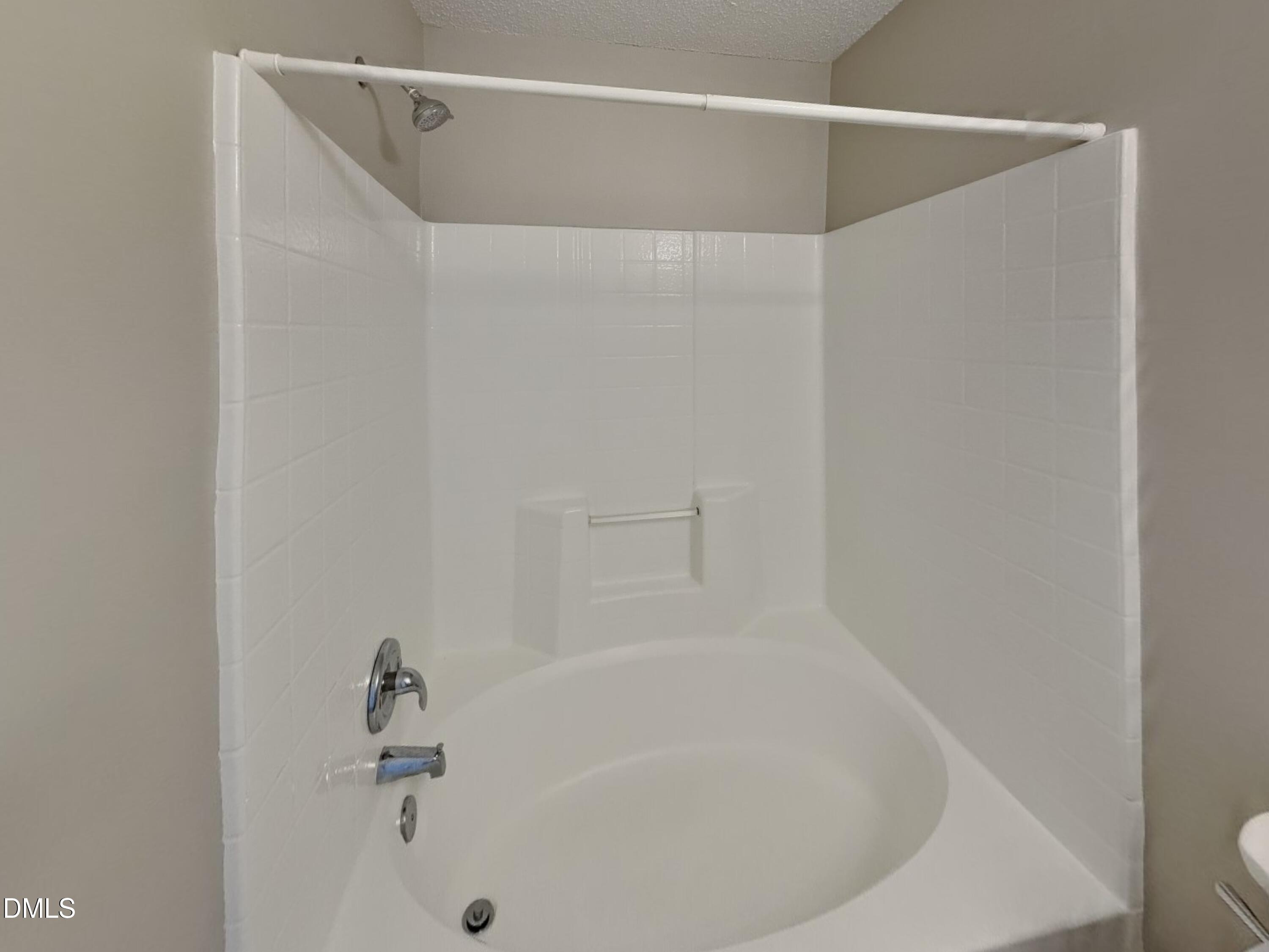 5516 Wilhagan Court Raleigh, NC 27616 - Photo 9 of 16 a bathroom with a bathtub