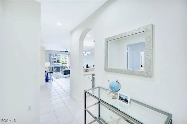 an entrance to house with yard and green space