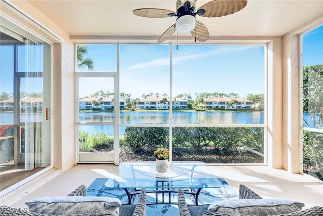 a view of a lake with houses in the back