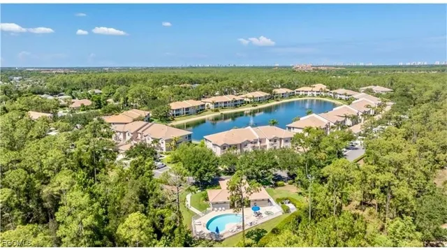 a view of swimming pool with outdoor seating and plants