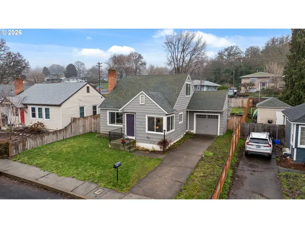 a aerial view of a house with a yard