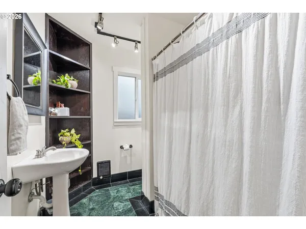 a balcony with table and chairs