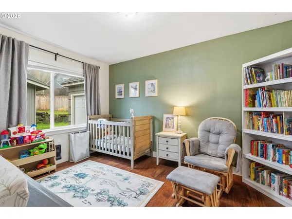 a bedroom with furniture and a book shelf