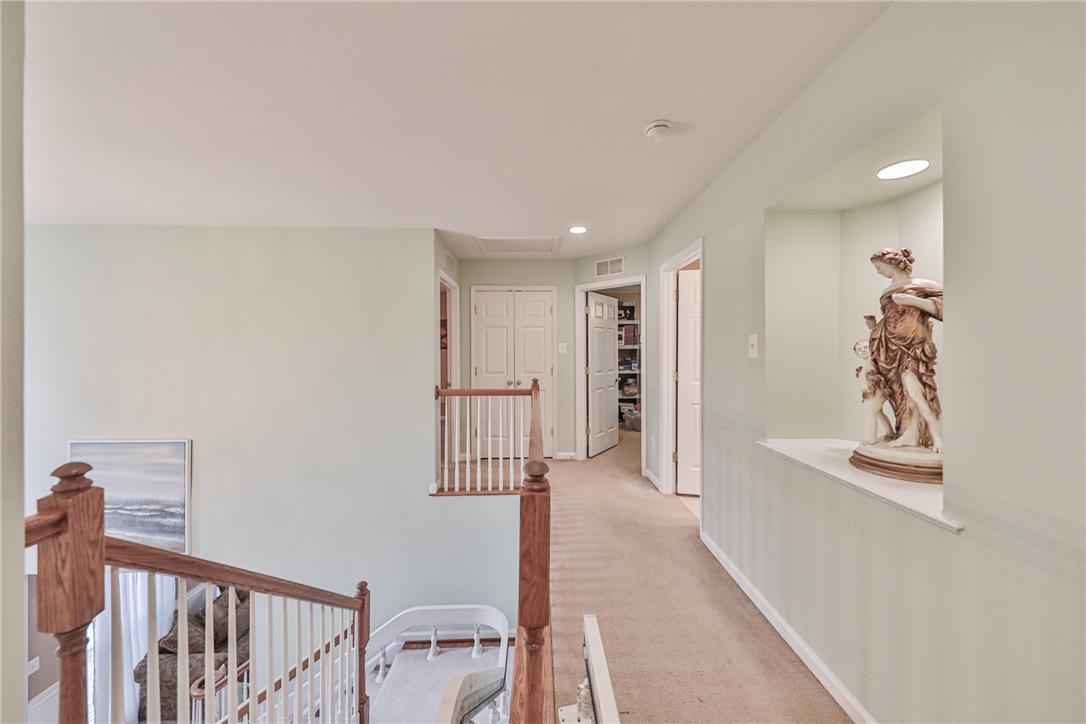 138 Clover Hollow Road Easton, PA 18045 - Photo 33 of 95 A well-lit upper landing, offering a graceful transition between levels with built-in display niche.