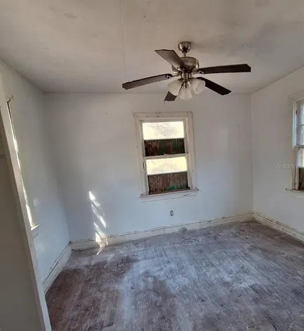 a view of an empty room and window