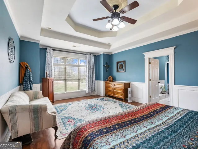 a bedroom with furniture and a window