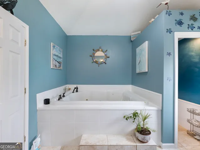 a bed room with a bed and furniture