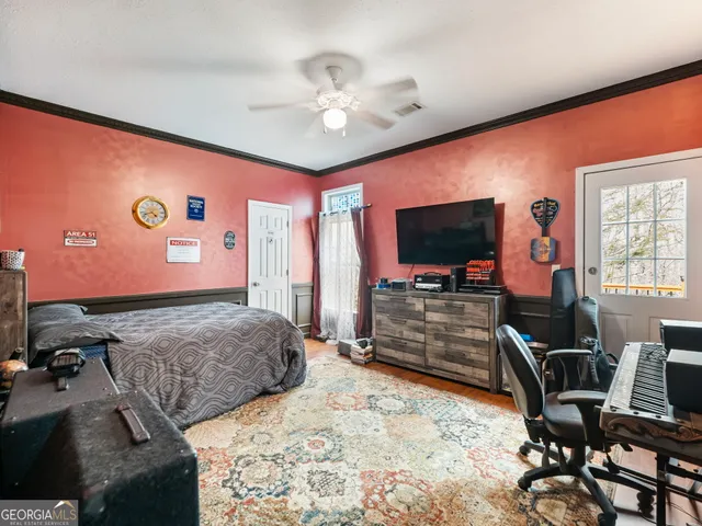 a living room with furniture a rug and a chandelier