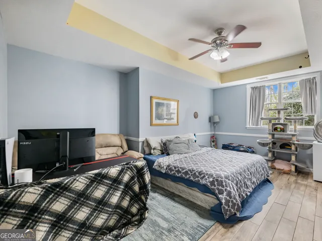 a view of a white house with a yard and plants