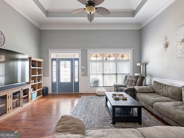 a view of a dining room with furniture and wooden floor