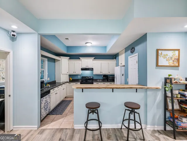 a view of a swimming pool with a patio