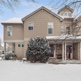 a view of a house with a yard and garage