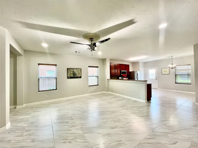 a large kitchen with cabinets and stainless steel appliances