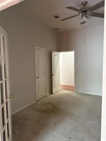 a view of a livingroom with a fireplace a chandelier and wooden floor