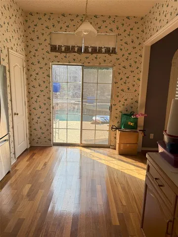 wooden floor in an empty room with a fireplace