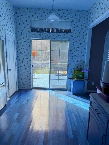 a view of a livingroom with wooden floor