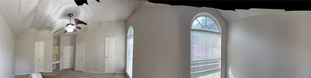 a view of empty room with windows