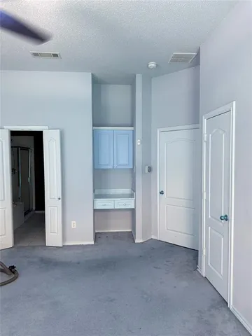a view of an empty room and closet