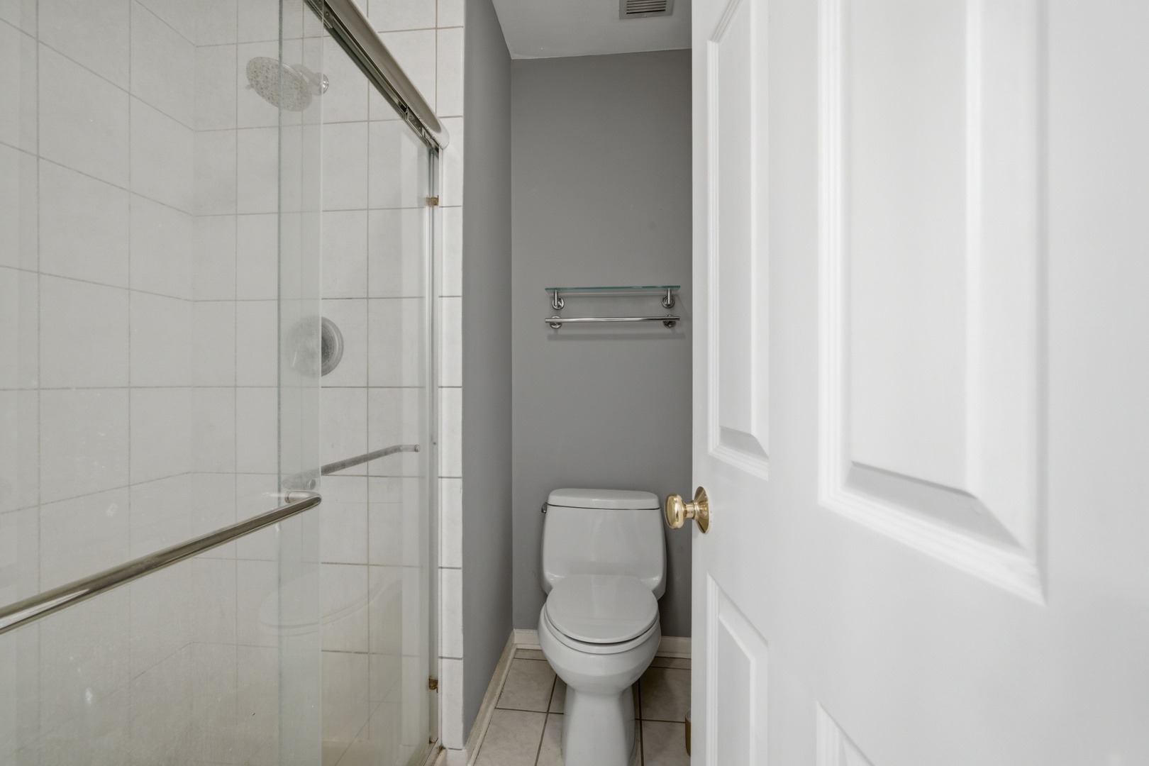 2113 Ammer Ridge Court, Unit 301 Glenview, IL 60025 - Photo 13 of 21 a bathroom with a toilet and a shower