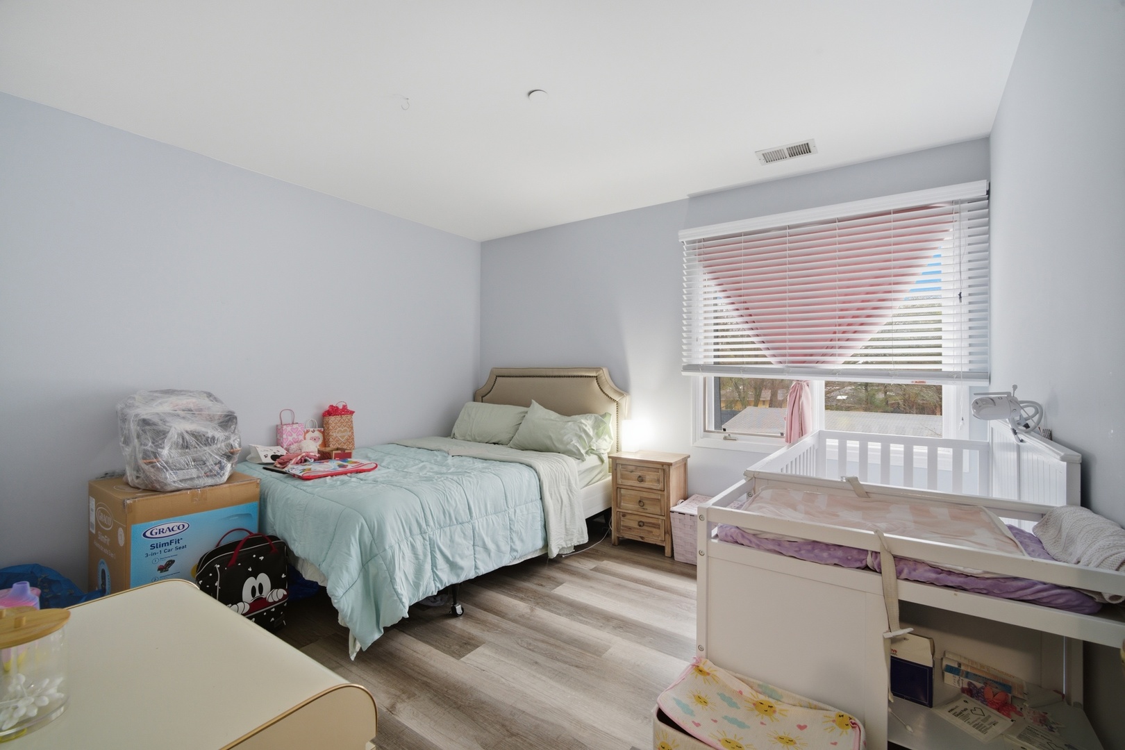 2113 Ammer Ridge Court, Unit 301 Glenview, IL 60025 - Photo 14 of 21 a bedroom with a bed and a window