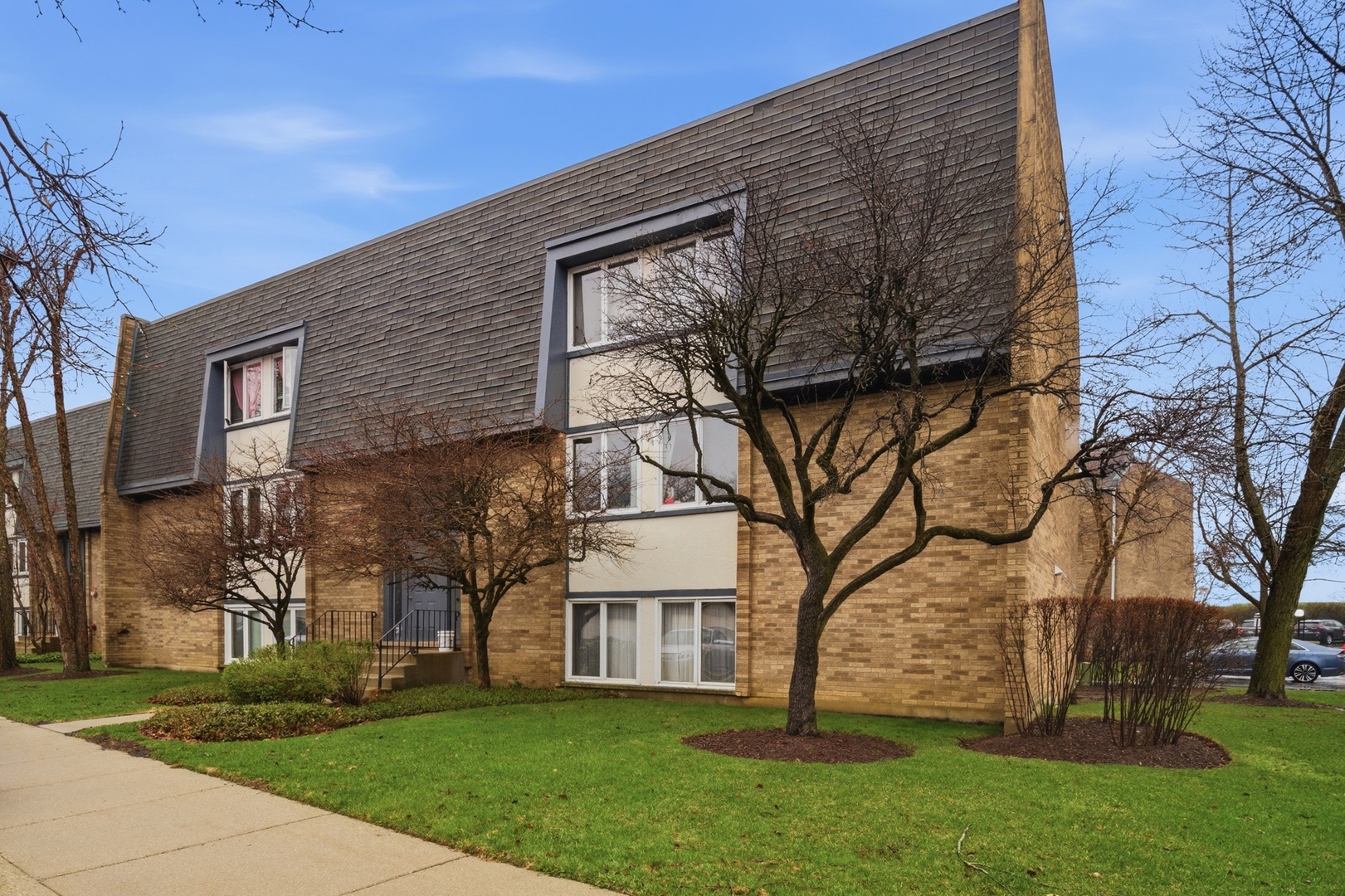 2113 Ammer Ridge Court, Unit 301 Glenview, IL 60025 - Photo 19 of 20 front view of house with a yard