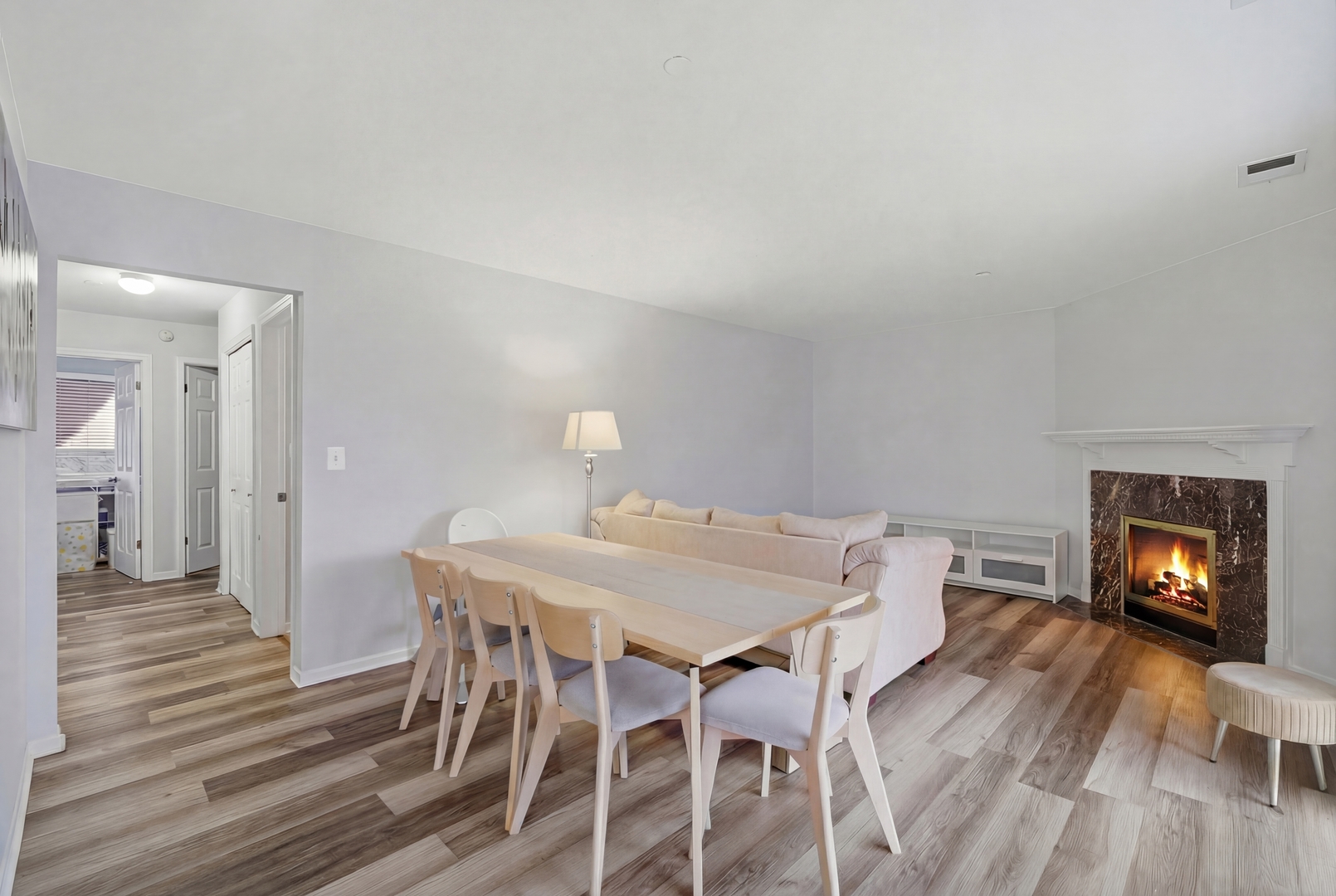 2113 Ammer Ridge Court, Unit 301 Glenview, IL 60025 - Photo 3 of 21 a view of a dining room with furniture and wooden floor