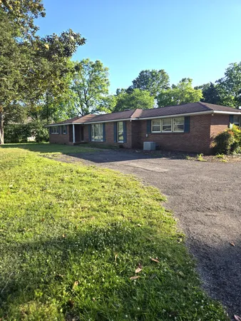 a front view of a house with yard