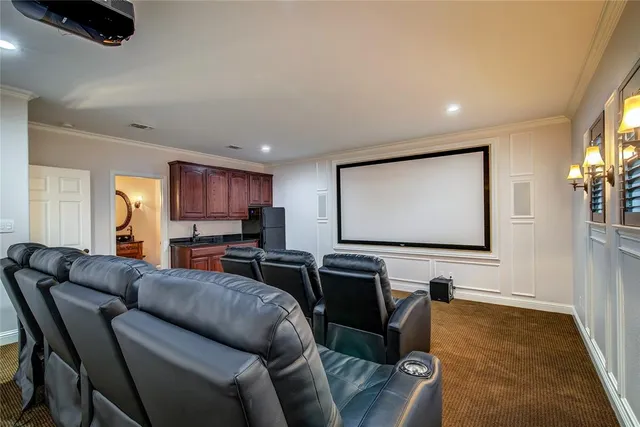 a room with furniture projector and screen