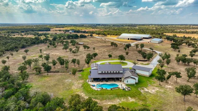 an aerial view of residential houses with outdoor space
