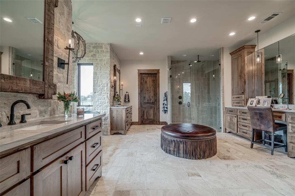 501 Grimes Road Mineral Wells, TX 76067 - Photo 20 of 40 a bathroom with a sink a toilet a mirror and shower