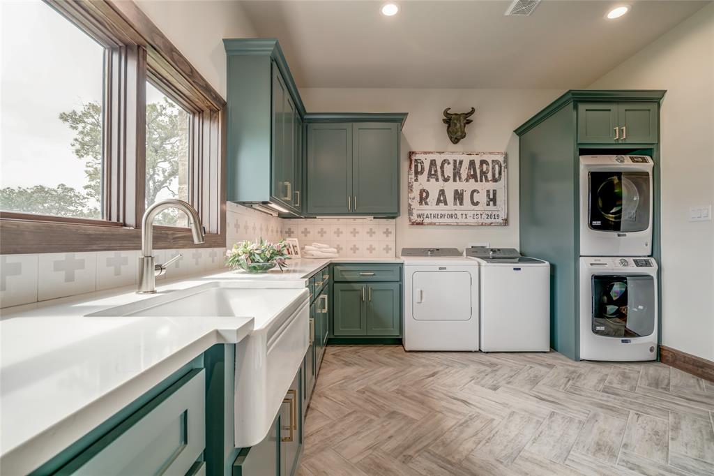 501 Grimes Road Mineral Wells, TX 76067 - Photo 21 of 40 a kitchen with a sink cabinets and window
