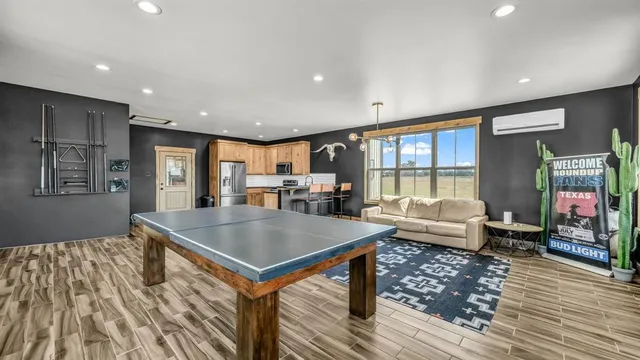 a sitting area with furniture and a wooden deck