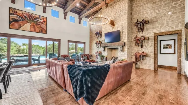 an aerial view of a house with a yard and lake view