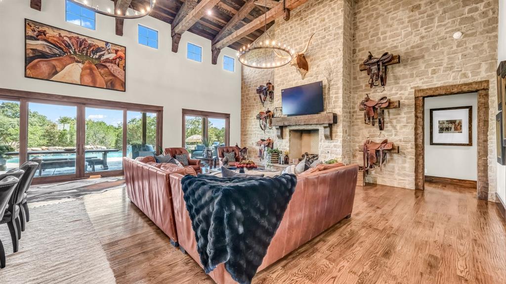 501 Grimes Road Mineral Wells, TX 76067 - Photo 31 of 40 a living room with fireplace furniture and a large window