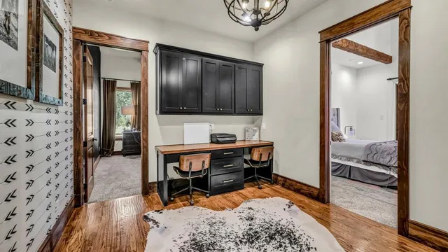 a bed sitting in a bedroom next to a window