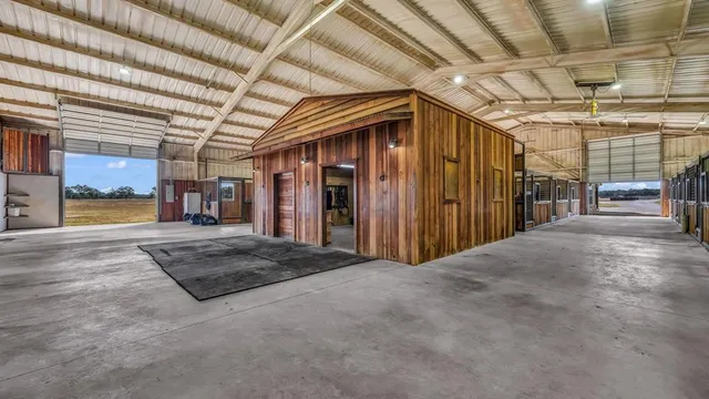 a view of a hallway with wooden walls