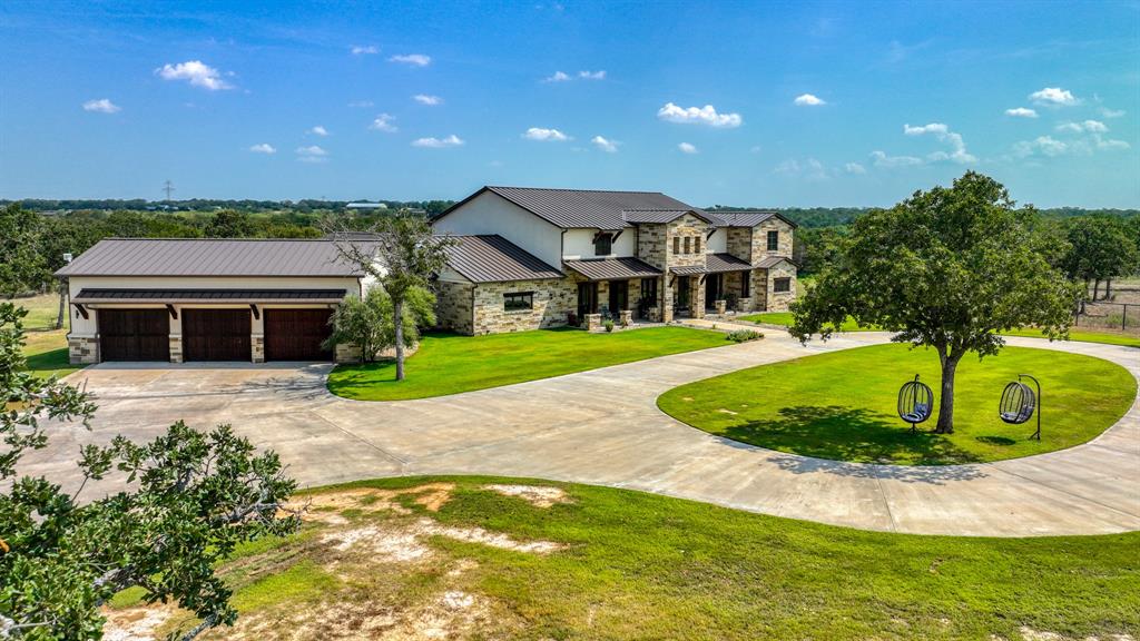 501 Grimes Road Mineral Wells, TX 76067 - Photo 9 of 40 a view of a house with a swimming pool and a yard
