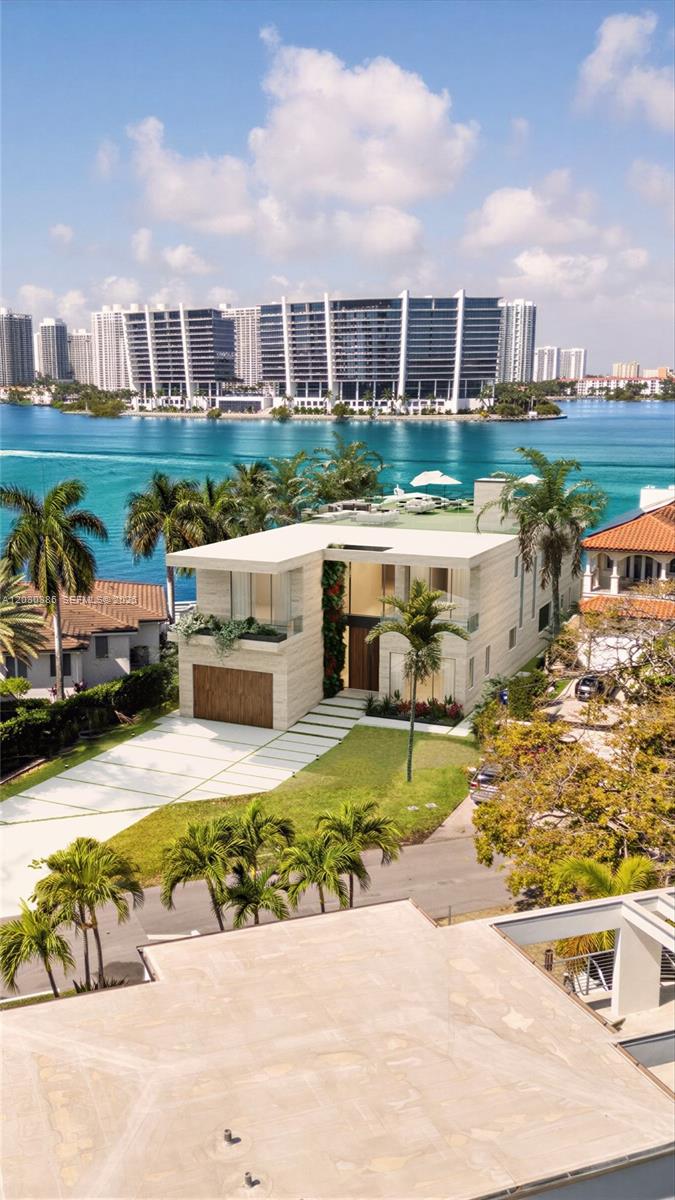 18800 North Bay Road Sunny Isles Beach, FL 33160 - Photo 2 of 17 a view of a swimming pool and a yard