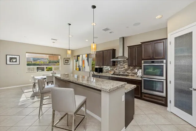 a spacious bedroom with a bed and a window