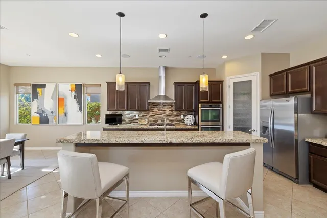 a view of walk in closet with clothes