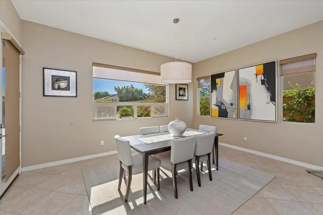 a spacious bathroom with a granite countertop sink and a mirror
