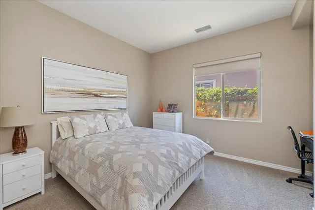 a view of a house with swimming pool and sitting area