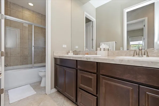 a aerial view of a house with swimming pool having outdoor seating