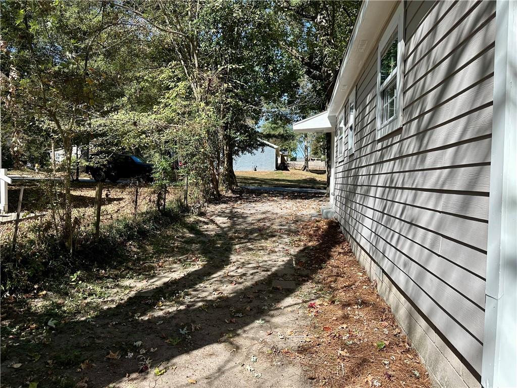 55 Bay Street Northeast Fairburn, GA 30213 - Photo 14 of 15 a view of a backyard with pathway