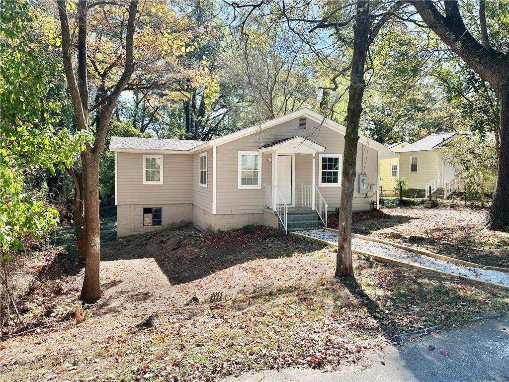 55 Bay Street Northeast Fairburn, GA 30213 - Photo 2 of 15 a front view of a house with a yard