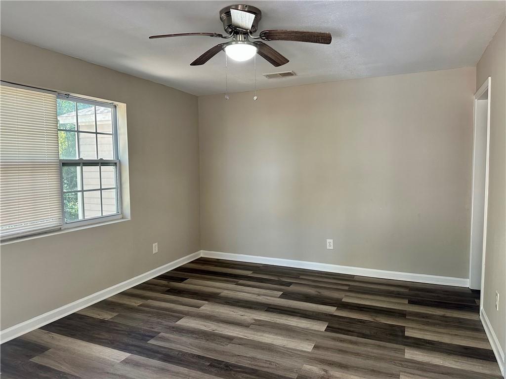 55 Bay Street Northeast Fairburn, GA 30213 - Photo 3 of 15 a view of room with window and ceiling fan