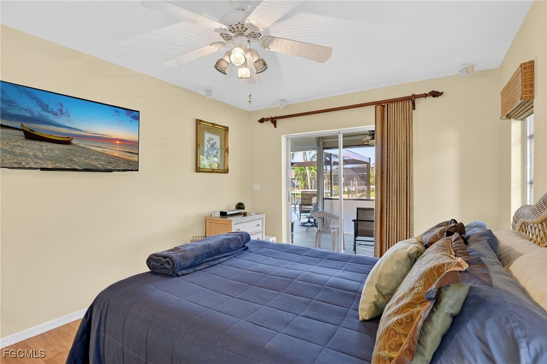 4306 Southwest 3rd Avenue Cape Coral, FL 33914 - Photo 22 of 50 a bed sitting in a bedroom next to a window