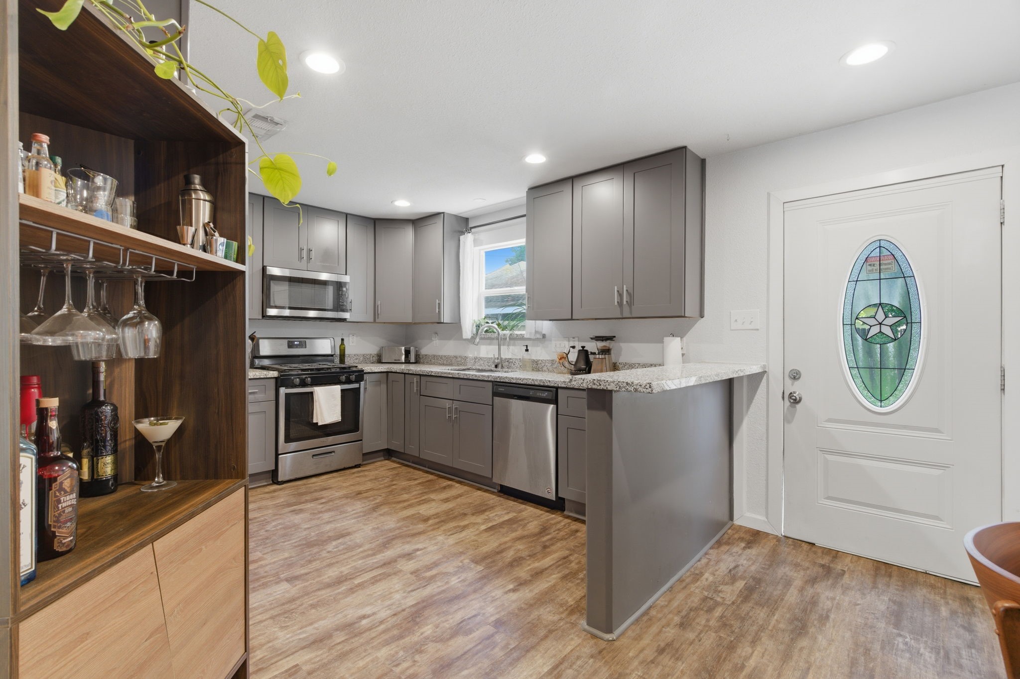 7717 Scanlock Street Houston, TX 77012 - Photo 13 of 46 Vinyl Plank flooring durable and water resistant