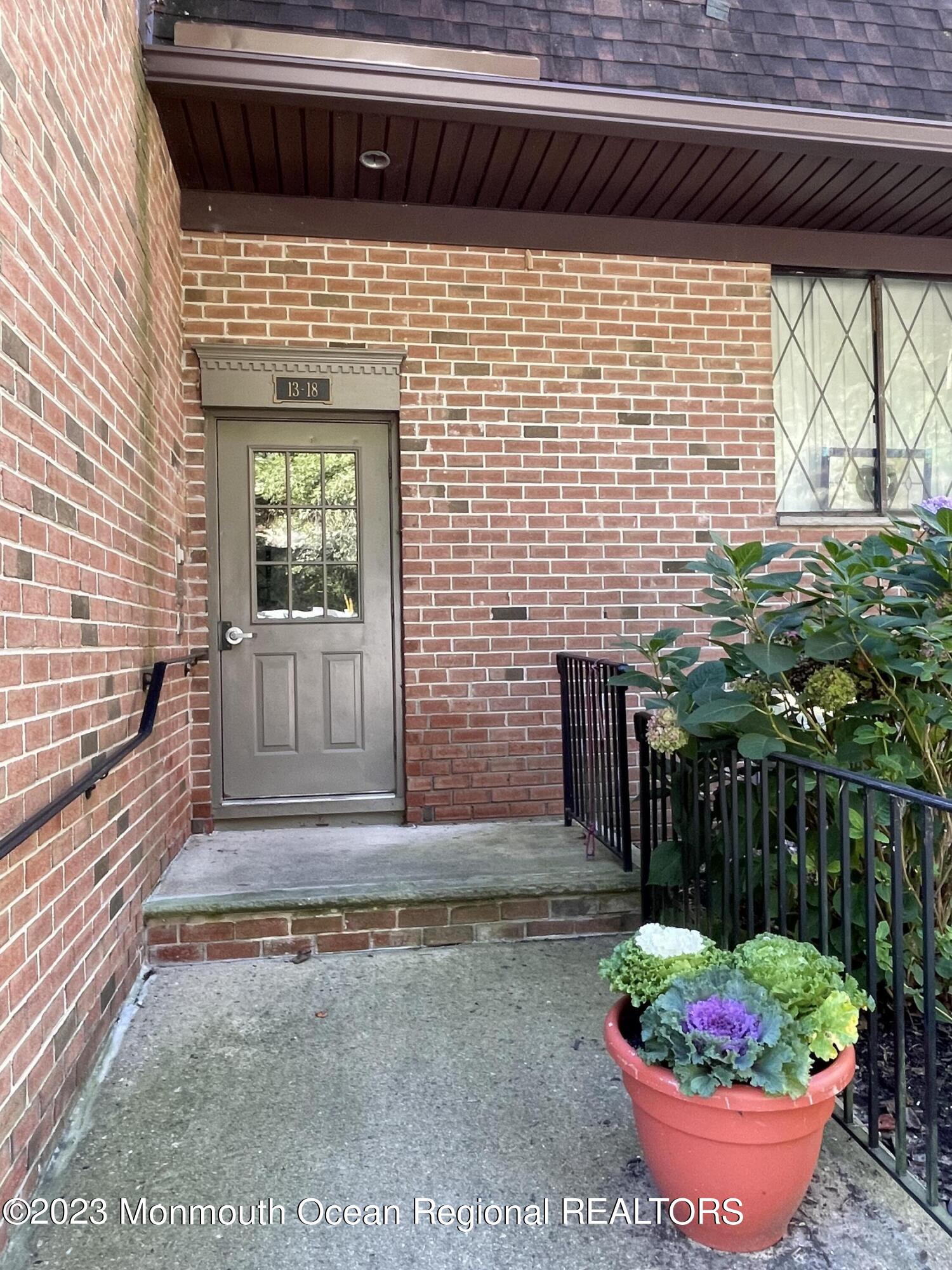 200 Portland Road, Unit E15 Highlands, NJ 07732 - Photo 1 of 21 a front view of a house with a garden