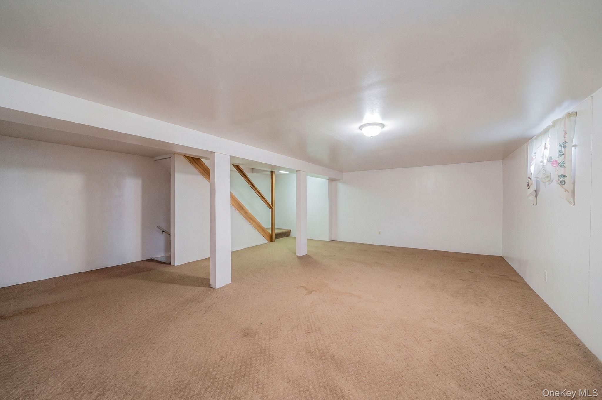 1169 Little E Neck Road West Babylon, NY 11704 - Photo 22 of 28 an empty room with a empty space and windows